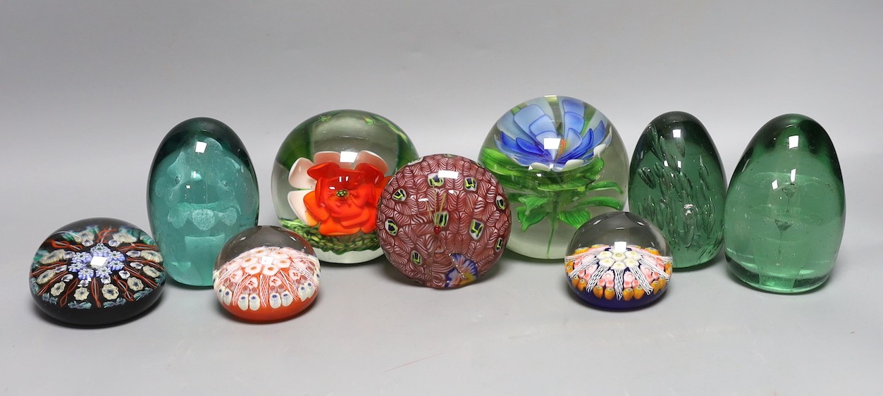 A collection of nine glass paperweights including Victorian dumps and millefiori